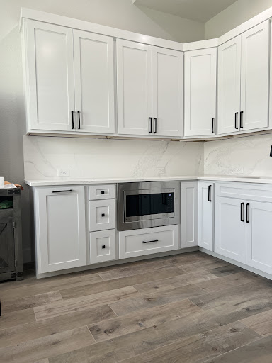 New cabinets and countertops, paint, and drywall repair.